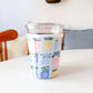 Spring Books | Reusable Coffee Sleeve